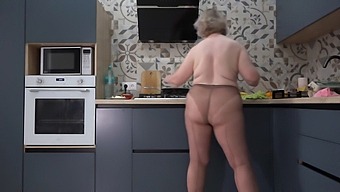 Watch A Busty Milf With A Big Ass In Nylon Pantyhose In The Kitchen